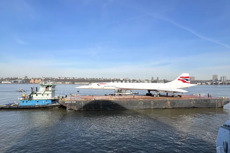 The British Airways Concorde sails on a barge in the Hudson River
