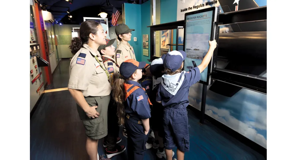 A group of Boy Scouts explore A View from the Deep exhibition