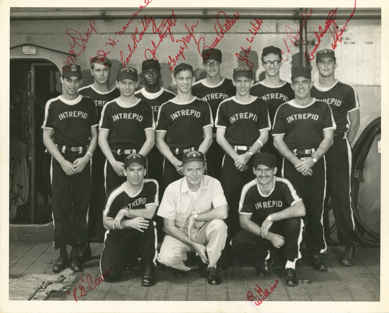 Signed photo of Intrepid’s softball team posting with the ship’s captain, 1968.