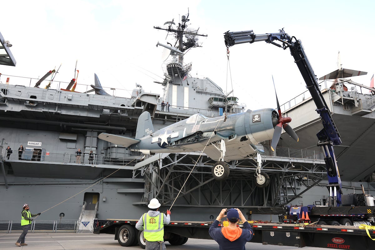 
The newly arrived Corsair being transported from the Pier to the flight deck to be restored before joining the Museum’s new exhibition.  