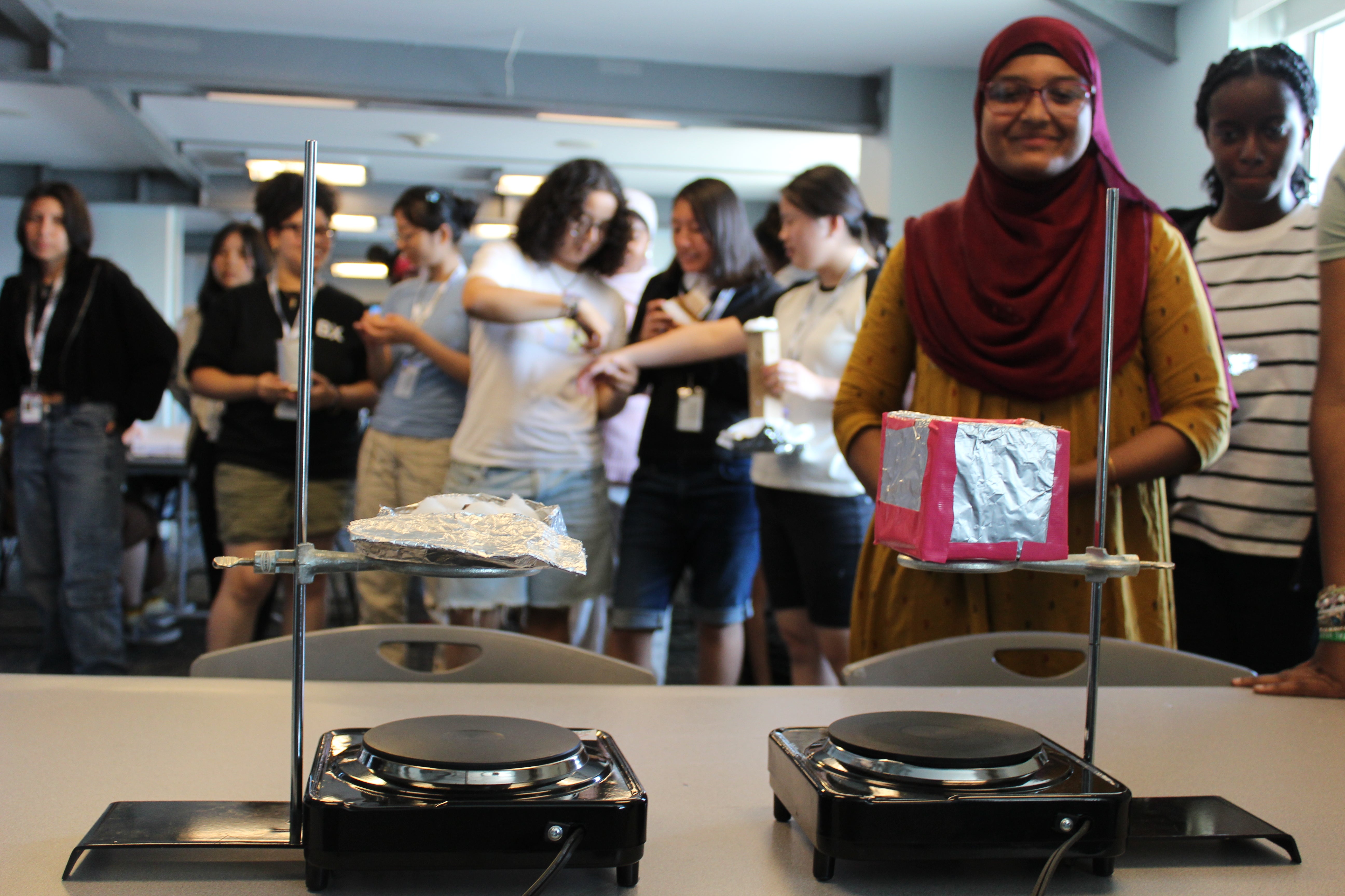 A group of young students engaged in hands-on STEM activities during Space Day at the Intrepid Museum.