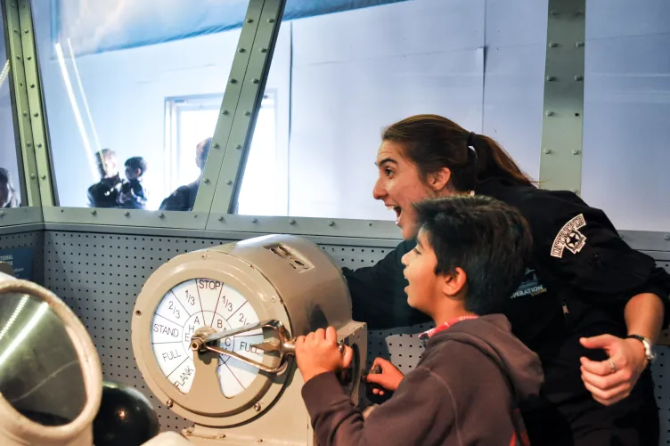 A mother and child are playing in the Museum's Exploreum.