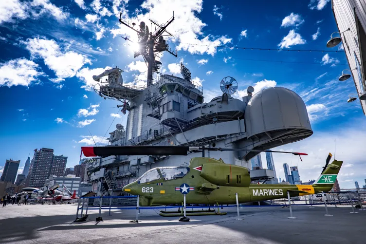 Image of the aircraft carrier Intrepid at Pier 86 on a sunny day.