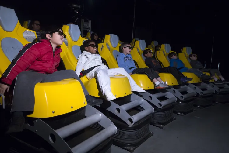 Kids seating in G-Force simulators rides