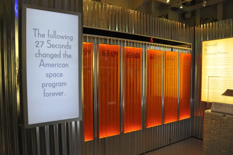 An exhibition panel that reads “The following 27 seconds changed the American space program forever.”