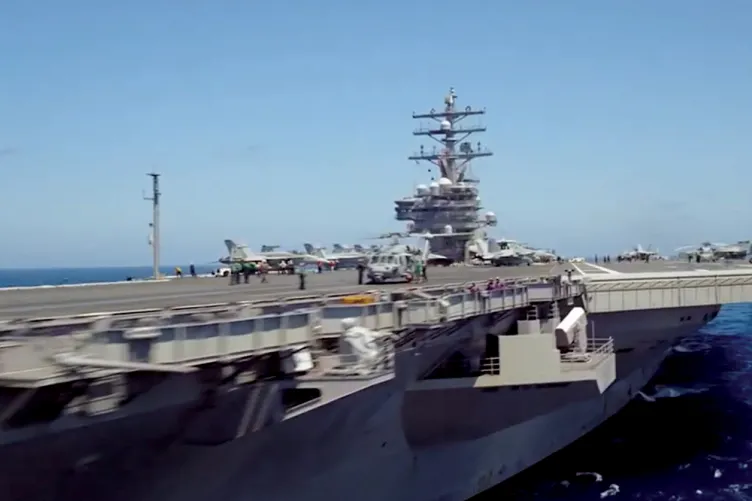 Video of an aircraft carrier in the ocean.