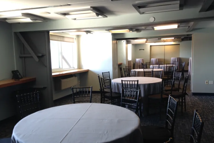A classroom with round tables set up