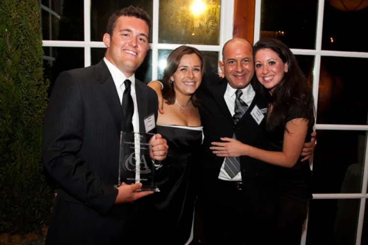 Intrepid Concierge Program Representative Jason Sullivan, Intrepid Director of Groups and Tourism Kim Wright, Vincent Timpone, VP Sales and Marketing for Davler Media and Intrepid Marketing Manager Desiree Scialpi following the Intrepid’s win.