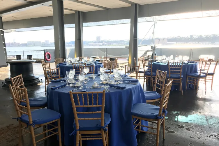 Tables set up for an event on the Fantail