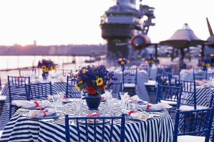 Tables set up for a reception on the flight deck