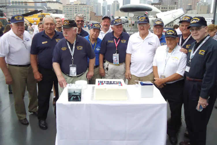 Intrepid’s former crewmembers and their anniversary cake