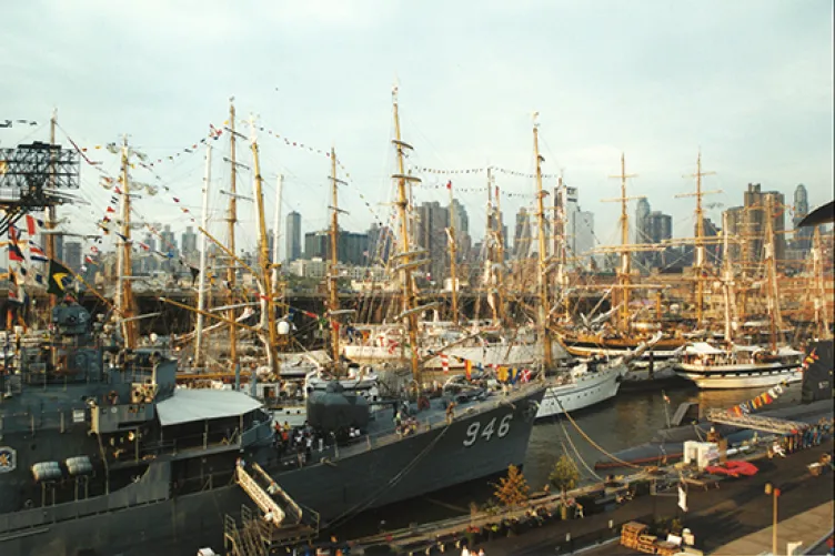 A number of different sailboats on the water during OpSail 2000