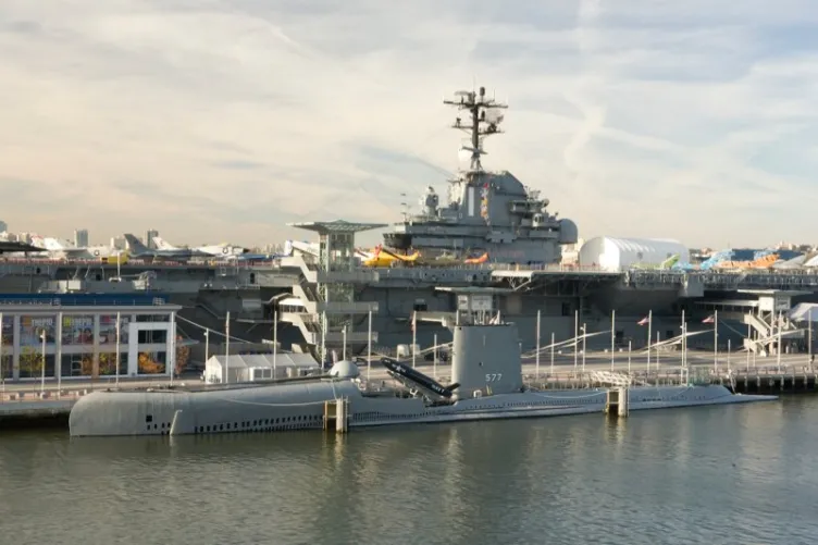 an image of the uss growler submarine in front of the uss intrepid