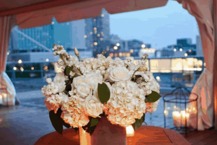 A table with a large floral centerpiece