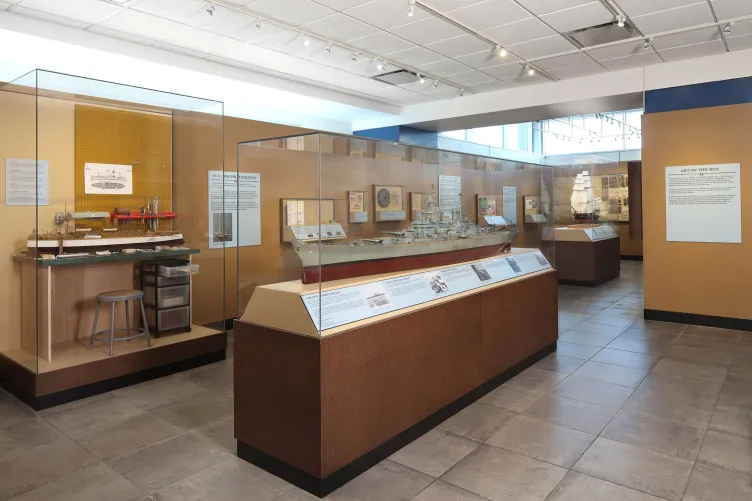 Display cases discussing and illustrating how ship models are made. 