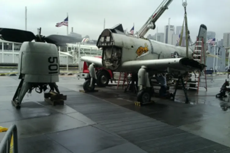 The Skyraider is assembled on the pier after arrival from Naval Air Station Oceana, where it was displayed for decades since its retirement.