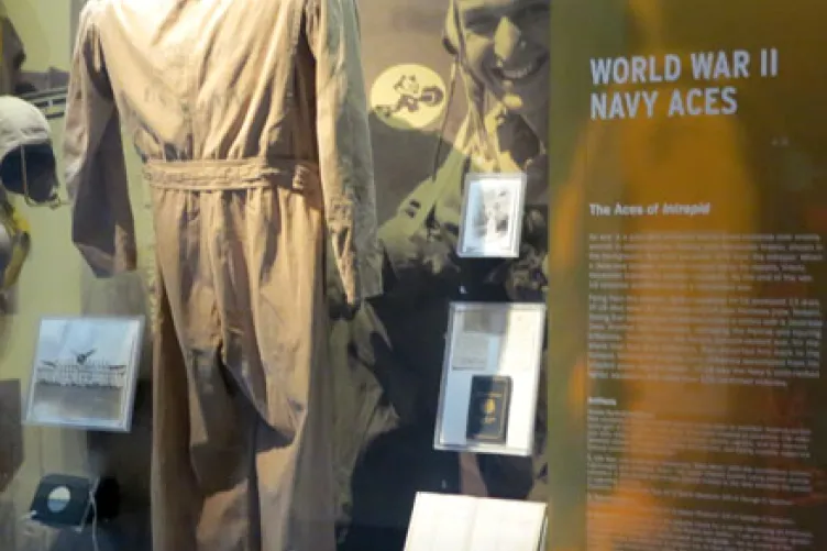 A display case that features a WWII uniform jacket.