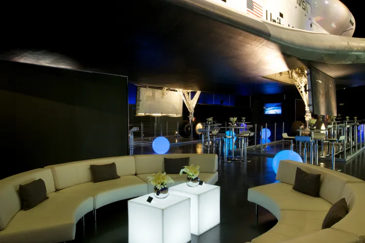 Two couches set up beneath Enterprise for an event
