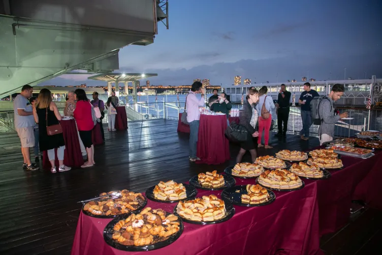 Members enjoy refreshments on the Port Side Aircraft Elevator during Members Night
