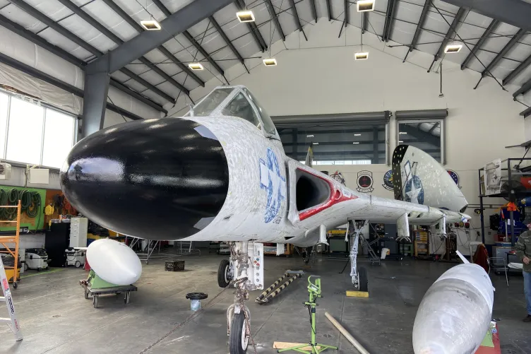 Aircraft inside a tent.