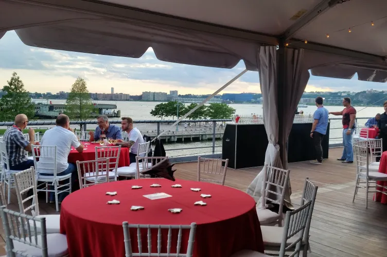 Event attendees sitting at tables during an event.