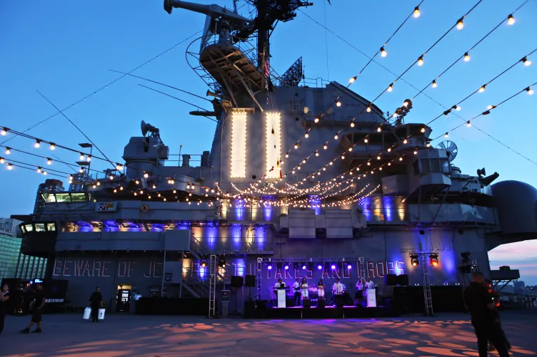 Band playing in front of the Intrepid Island