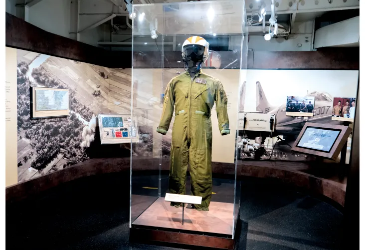 Fighter Pilot uniform with helmet in an exhibition case