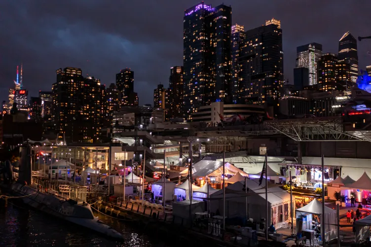 Night Shot of the New York Wine and Food Festival with buildings in the background