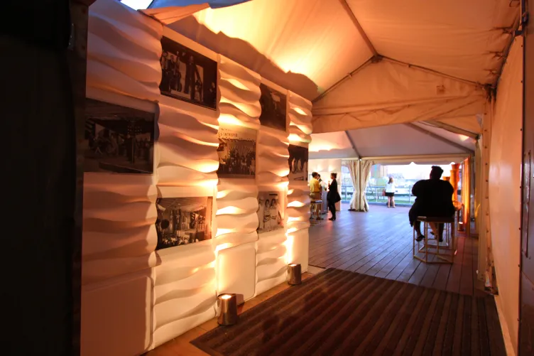 Entrance to tent with wall displaying art