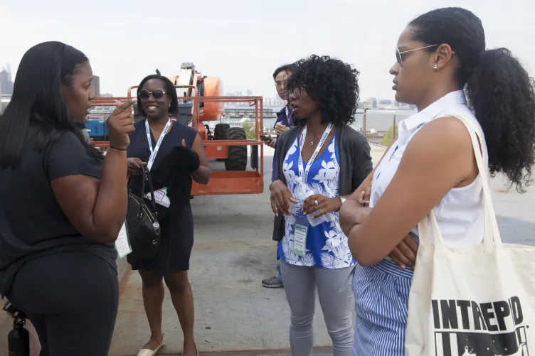A group of educators at the museum participating in activities.