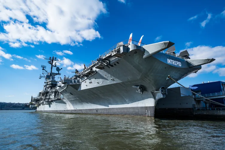 The Intrepid Museum tied to a pier.
