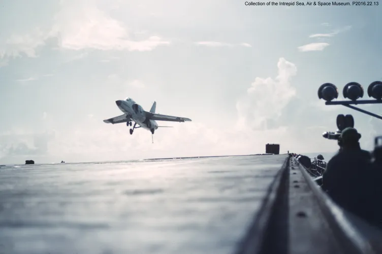 An airplane comes in to land on the flight deck.