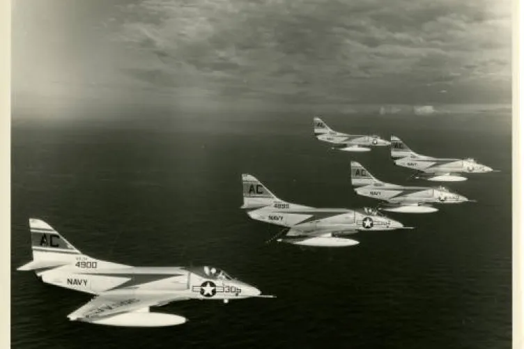 A squadron of jet planes flies in formation.