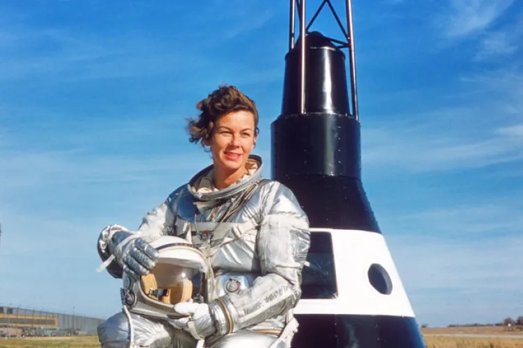 Betty Skelton in front of the Mercury Capsule Replica.