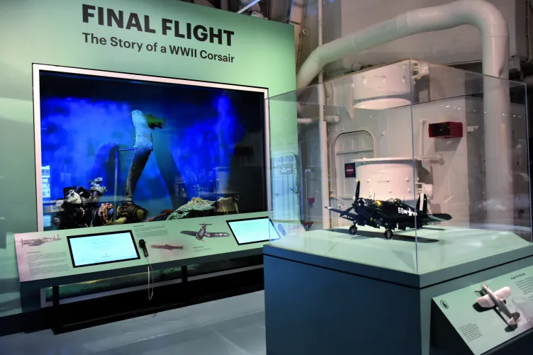 An image showcasing the Corsair exhibition at the Intrepid Museum.