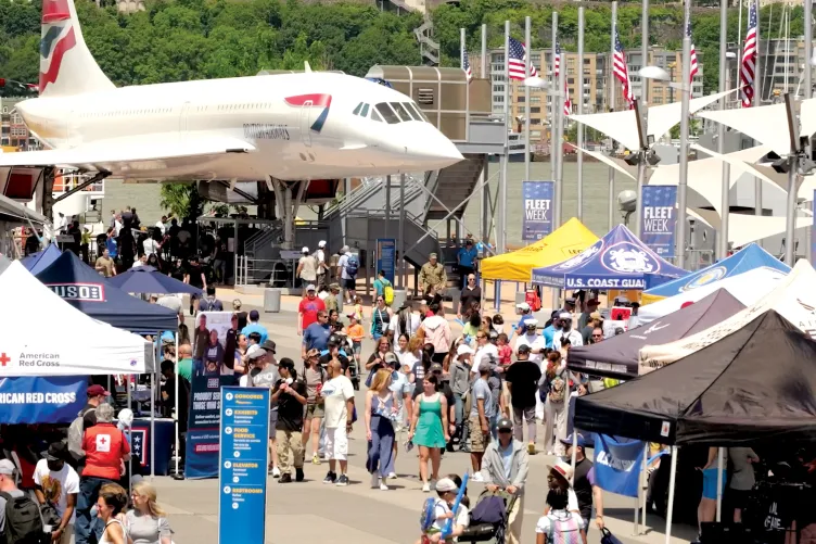 Visitors participating in Fleet Week activities on Pier 86 at the Intrepid Museum