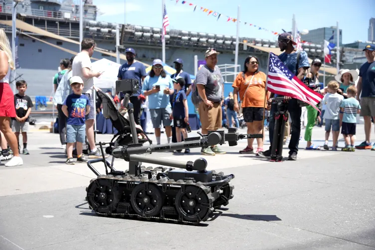 Visitors participating in Fleet Week activities on Pier 86 at the Intrepid Museum