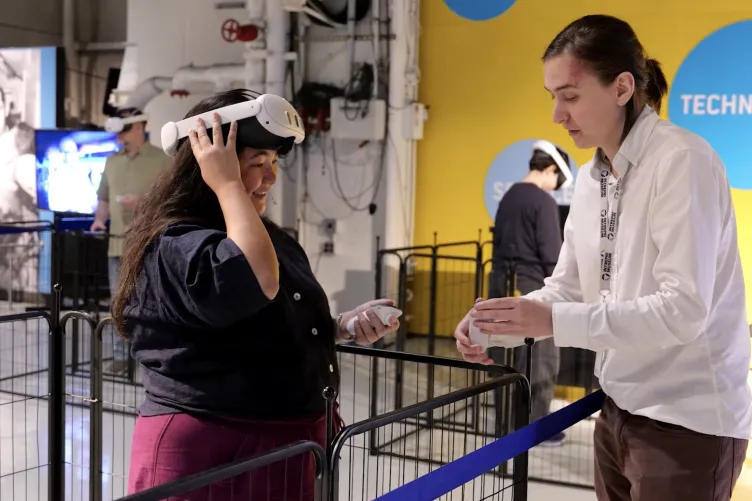 Guest explores the Intrepid's engine room through an immersive VR experience
