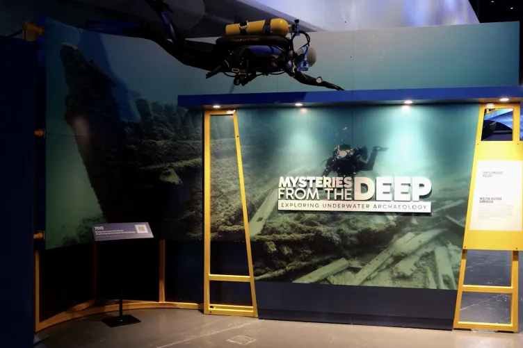 The entrance of the Space Shuttle Pavilion at the Intrepid Museum, featuring the Mysteries from the Deep: Exploring Underwater Archaeology exhibition.