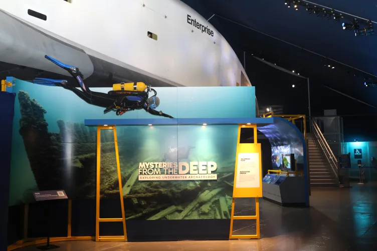 Inside the Mysteries from the Deep: Exploring Underwater Archaeology exhibition at the Intrepid Museum.