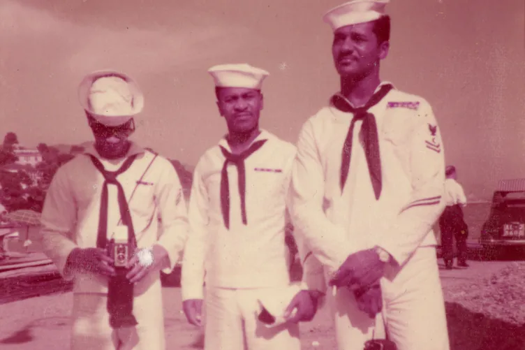 Archival photo of three sailors