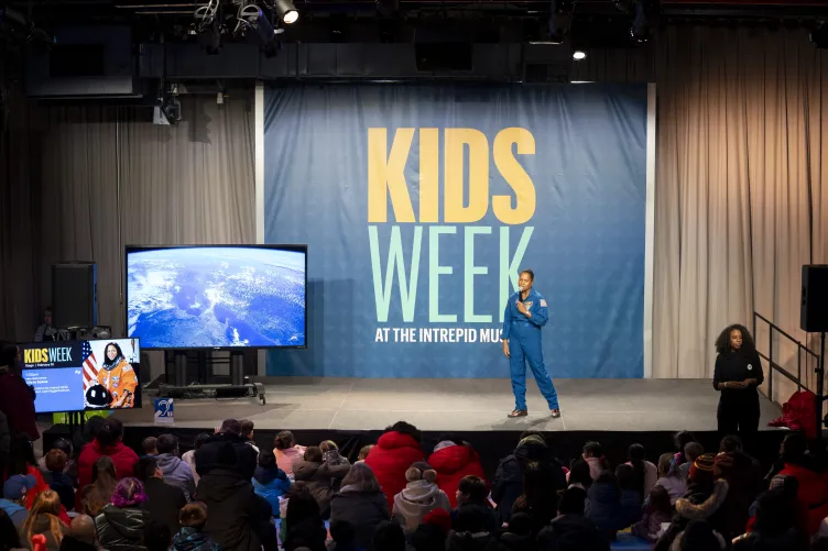 Female astronaut on stage at Kids Week 2024