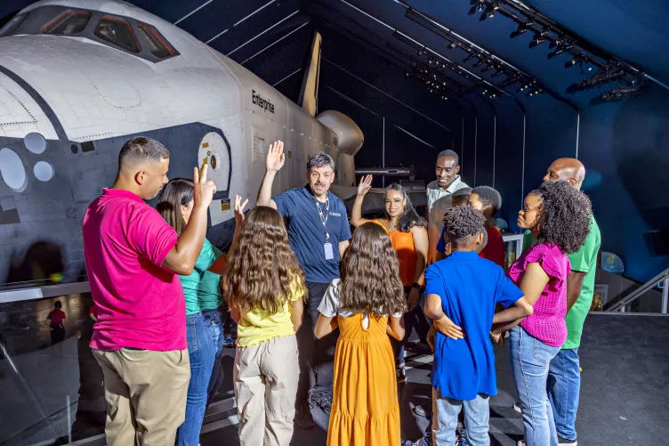 Guests on a highlight tour of the Intrepid Museum.
