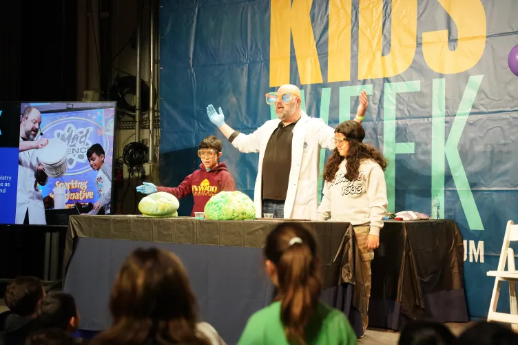 Kids and instructors on stage aboard Intrepid during Kids Week