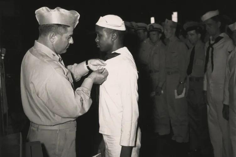 Captain Bolger Awards Medal to Eli Benjamin