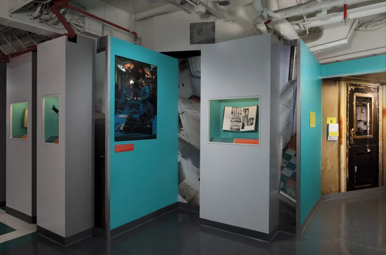 Exhibition panels in &quot;On the Mend: Restoring Intrepid&#039;s Sick Bay.&quot;