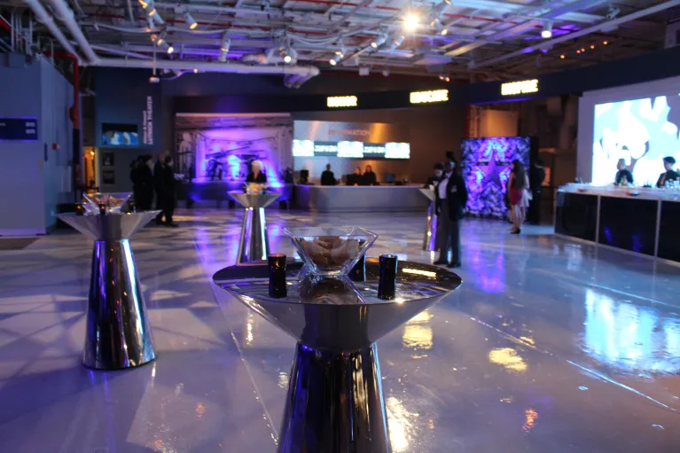 Cocktail tables set up in hangar 1