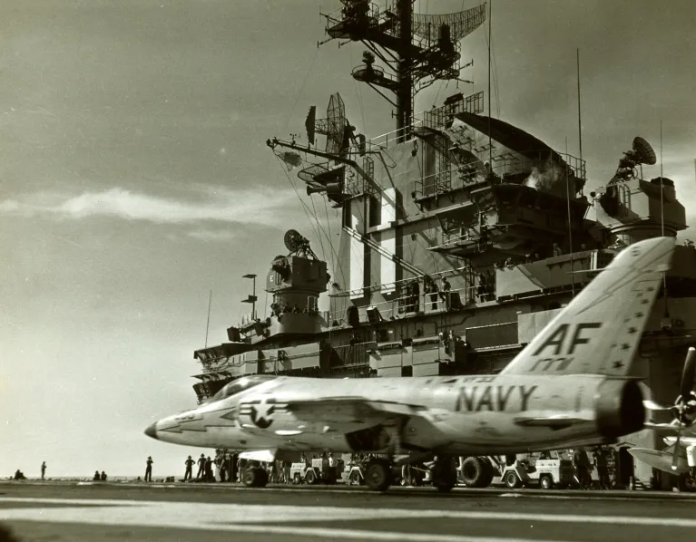 An archival photo of a plan on the flight deck