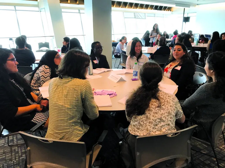 Goals for Girls participants at a round table in the Great Hall