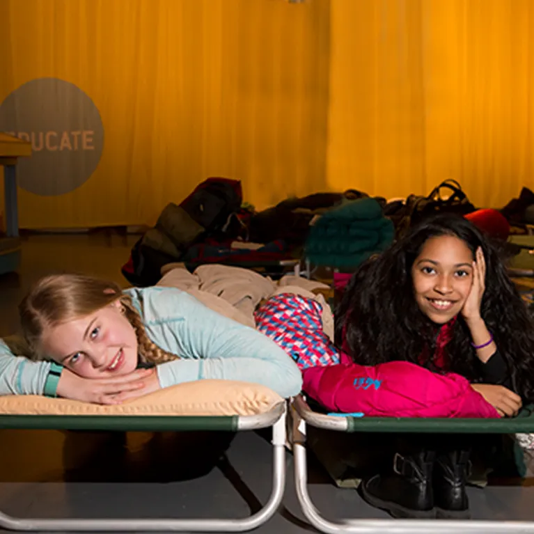 Image of two girls at a slumber overnight at the Museum.